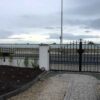 Black steel gate with matching railings - sea view